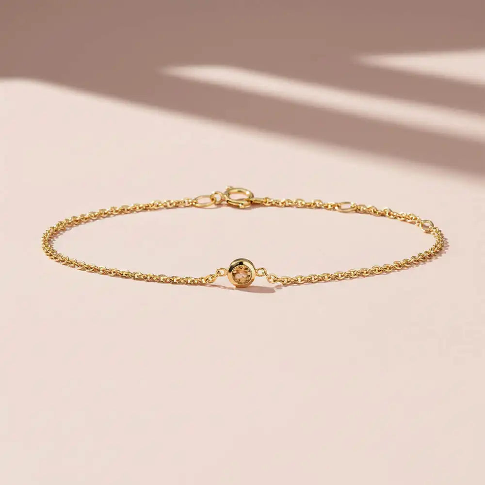 Bezel-set citrine bracelet in 14K yellow gold on adjustable curb chain variant--Sterling silver