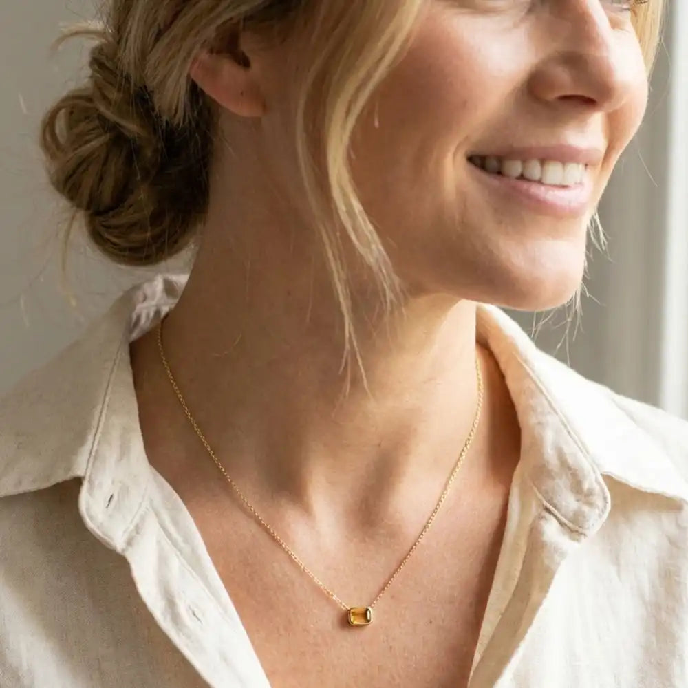November birthstone necklace featuring golden citrine shown on model variant--14K-yellow-gold variant--14K-white-gold variant--14K-rose-gold variant--Sterling-silver variant--Citrine