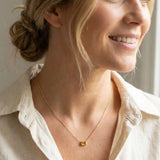 November birthstone necklace featuring golden citrine shown on model variant--14K-yellow-gold variant--14K-white-gold variant--14K-rose-gold variant--Sterling-silver variant--Citrine
