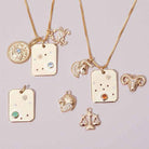 constellation necklace styled with other gold zodiac charms variant--14K-rose-gold
