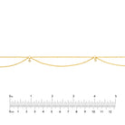 Diamond Drape necklace in 14K yellow gold with a ruler for scale.