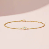 Bezel-set diamond birthstone bracelet. silver variant--14K-yellow-gold variant--Diamond