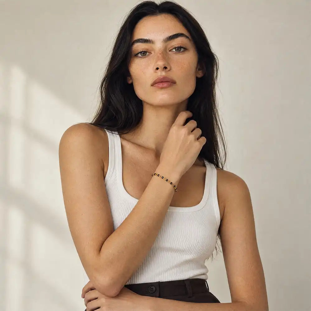 Black Enamel Gold-fill Bracelet worn on a model