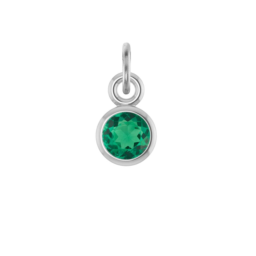Emerald birthstone charm bezel-set in 14k white gold — vivid green May gemstone jewelry.