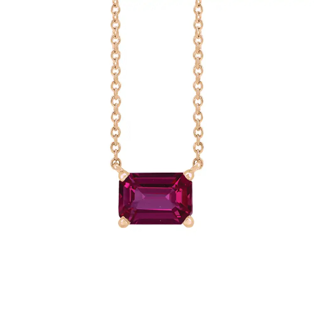 Minimalist 14K rose gold Ruby birthstone necklace featuring a 5x3mm emerald-cut pendant. variant--Ruby variant--14K-rose-gold