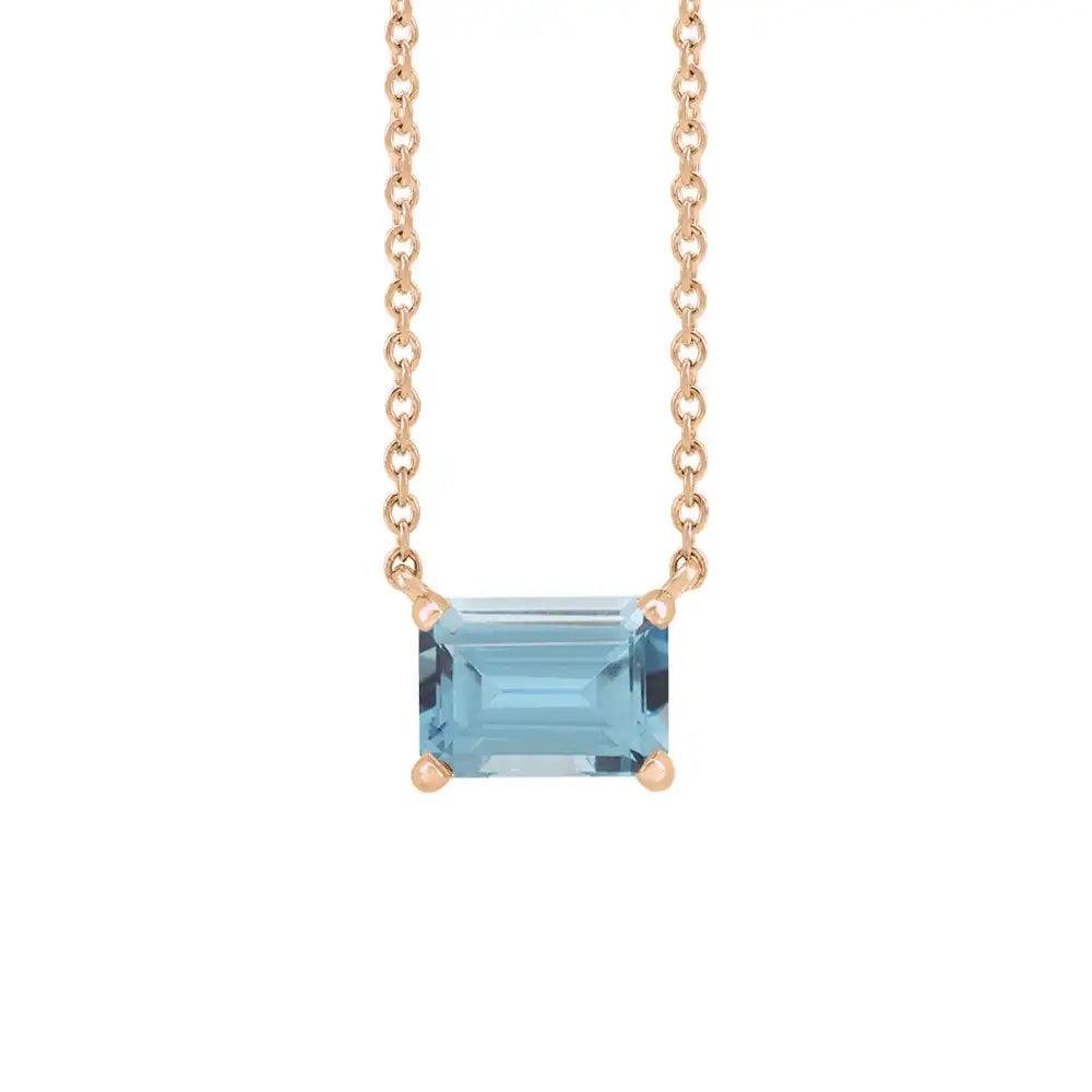 Emerald-cut zircon birthstone necklace set in 14K rose gold with minimalist pendant design variant--14K rose gold variant--zircon