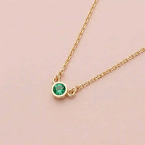 Bezel-set emerald birthstone necklace in 14K yellow gold on cable chain variant--14K-rose-gold variant--14K-white-gold variant--14K-yellow-gold variant--Sterling-silver variant--Emerald
