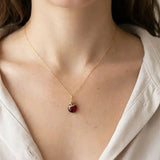 Handmade designer garnet pendant necklace shown on model variant--Gold-fill, variant--Rose-gold-fill, variant--Sterling-silver, variant--Oxidized-sterling-silver variant--Garnet
