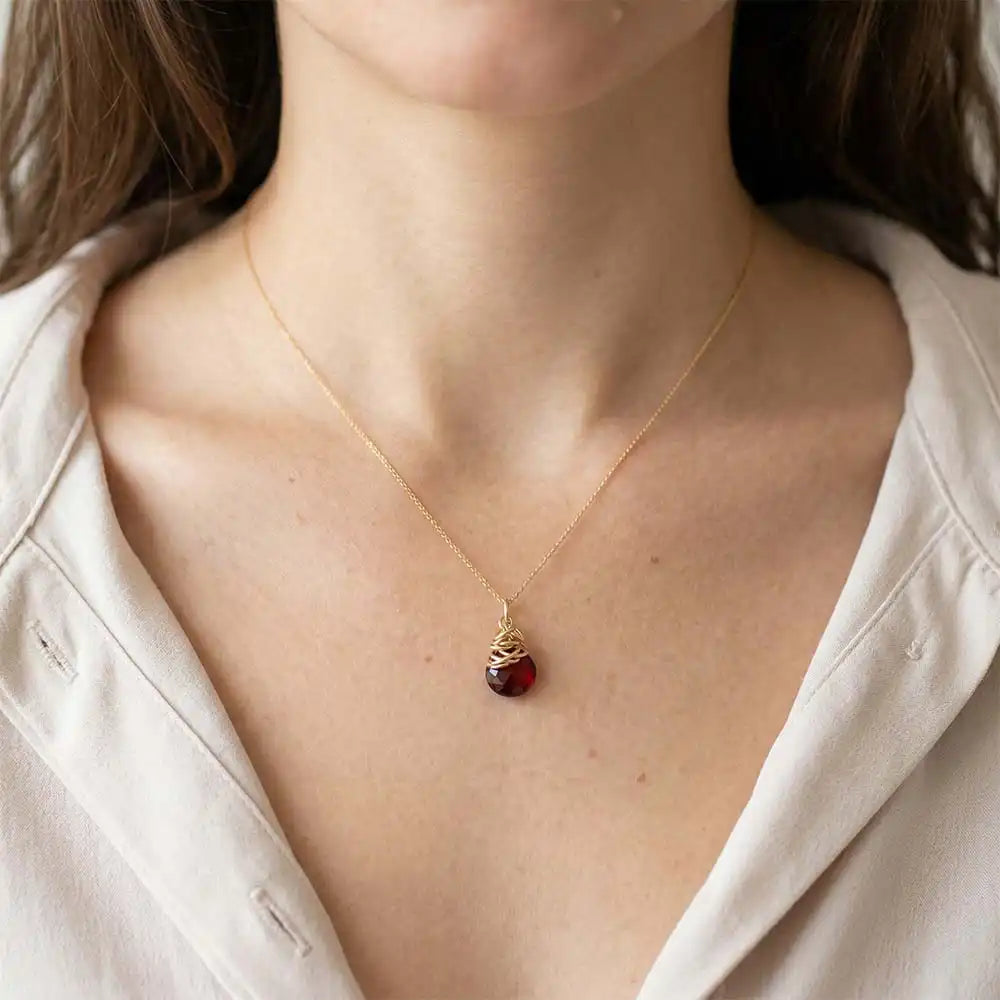 Natural garnet pendant necklace in sterling silver, close-up of setting in gold-fill variant--Garnet variant--Gold-fill variant--Sterling-silver