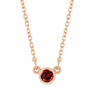 Bezel-set garnet birthstone necklace in 14K rose gold, product view