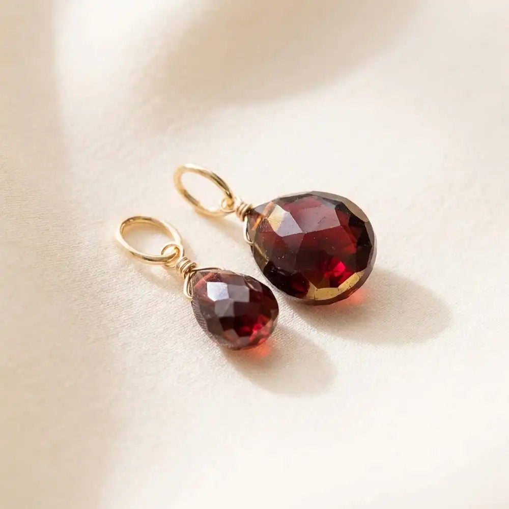 Teardrop-shaped garnet gemstone in 6mm, wire-wrapped in gold-fill for minimalist styling.