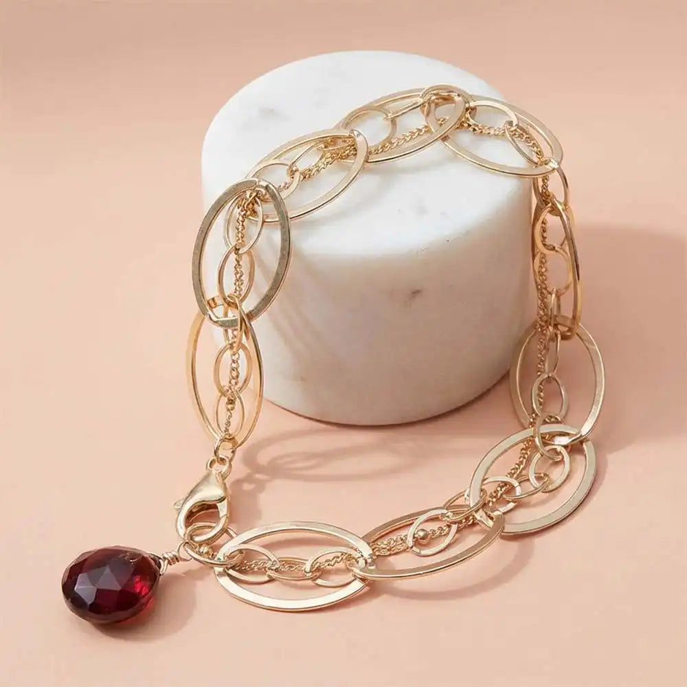 Natural garnet woven chain bracelet in sterling silver, styled on chain necklace variant--Gold-fill variant--Sterling-silver variant--Oxidized-sterling-silver variant--Garnet