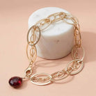 Natural garnet woven chain bracelet in sterling silver, styled on chain necklace