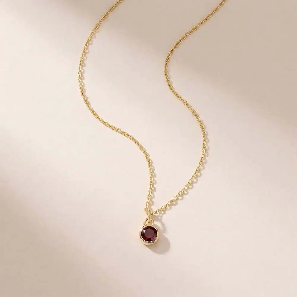 Garnet birthstone necklace ‚crafted in 14K gold with a vivid birthstone centerpiece