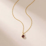 Garnet birthstone necklace ‚crafted in 14K gold with a vivid birthstone centerpiece
