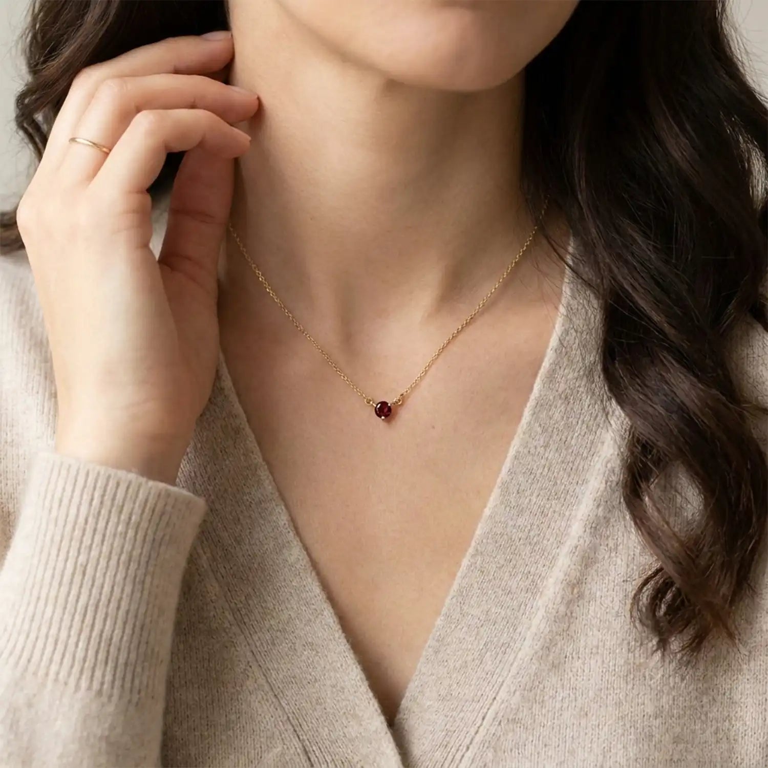 14K gold garnet necklace shown on model variant--14K-rose-gold,  variant--14K-yellow-gold,  variant--14K-white-gold, variant--Garnet, variant--Sterling-silver