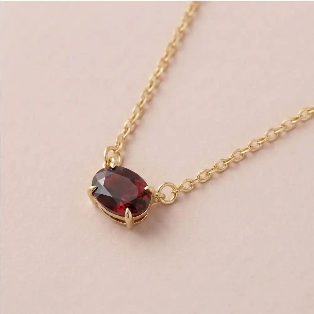 East west garnet necklace in 14K yellow gold with oval gemstone variant--14K-rose-gold variant--Garnet variant--14K-white-gold variant--14K-yellow-gold variant--Sterling-silver