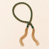 Green braided chain and silk tassel bracelet in 14K gold-fill, flat lay