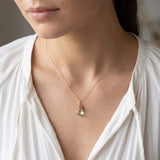 Natural green amethyst pendant necklace in sterling silver, close-up of setting in gold-fill