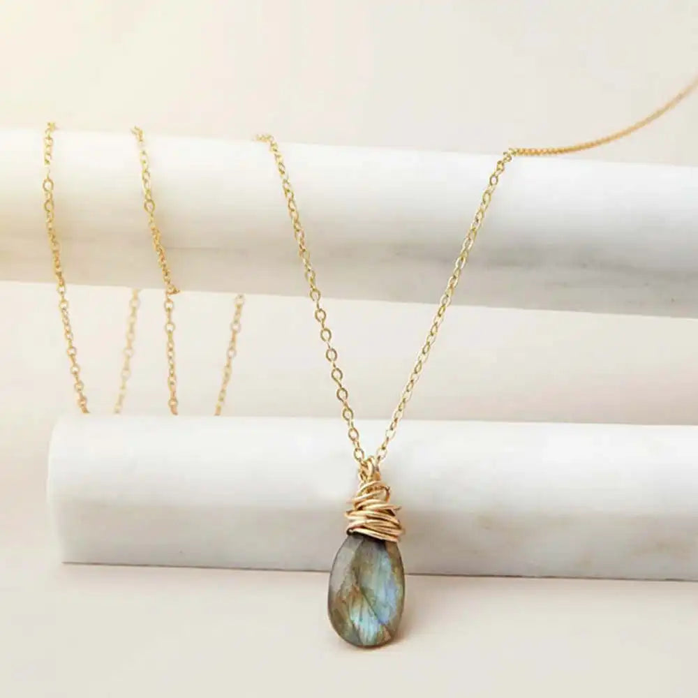 Natural labradorite pendant necklace in sterling silver, styled on chain necklace