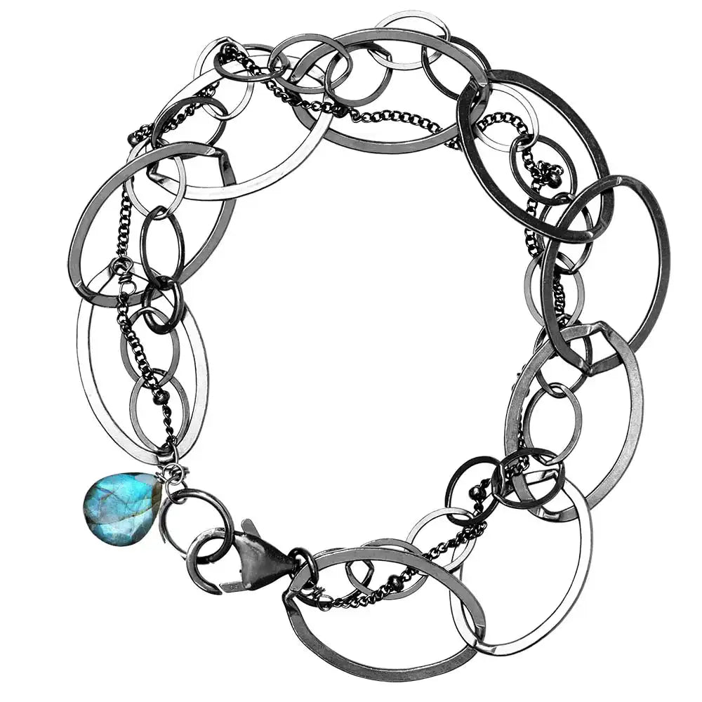 Natural labradorite woven chain bracelet in sterling silver, flat lay on neutral background sterling silver variant--Oxidized-sterling-silver