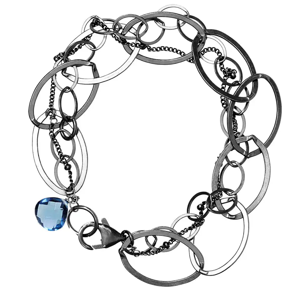 Natural london blue topaz woven chain bracelet in sterling silver, flat lay on neutral background sterling silver variant--Oxidized-sterling-silver