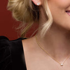 East west emerald-cut birthstone necklace with deep red garnet in 14K Yellow Gold — handmade in the USA