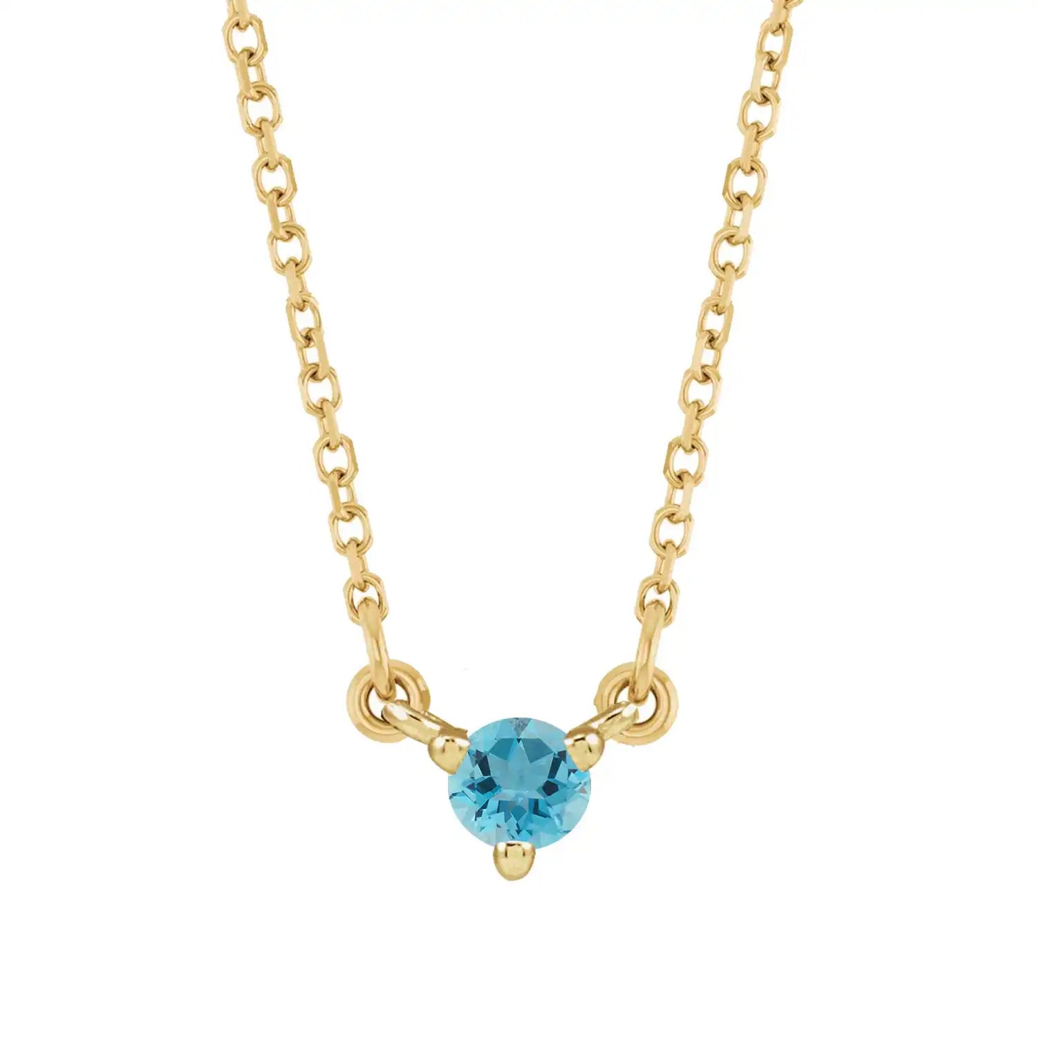 14K yellow gold birthstone necklace featuring a petite zircon charm on fine chain. variant--14K-yellow-gold