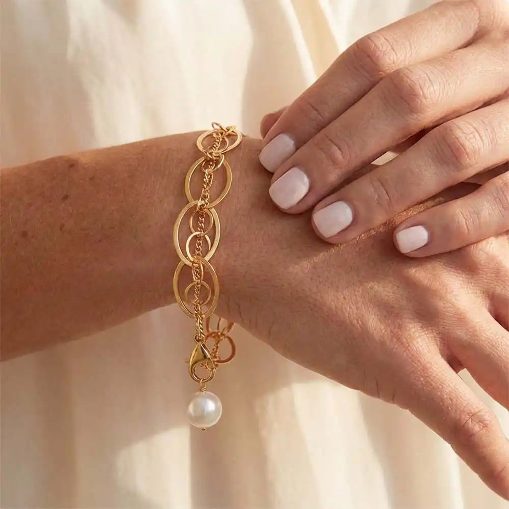 Natural pearl woven chain bracelet in gold-fill shown on model variant--Gold-fill variant--Sterling-silver variant--Oxidized-sterling-silver variant--Pearl
