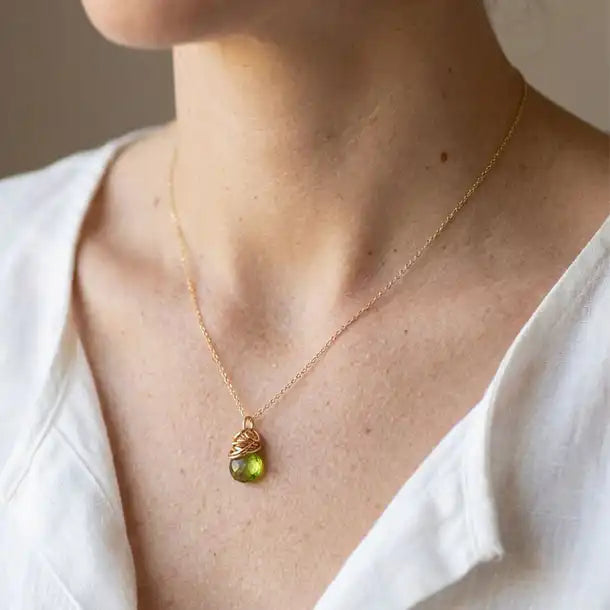 Handmade designer peridot pendant necklace shown on model variant--Gold-fill, variant--Rose-gold-fill, variant--Sterling-silver, variant--Oxidized-sterling-silver variant--Peridot