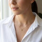 Peridot birthstone necklace, featuring a 3mm natural gemstone on a delicate chain