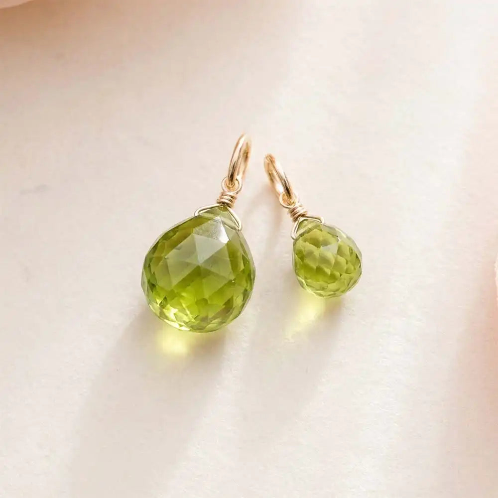 Teardrop-shaped peridot gemstone in 6mm, wire-wrapped in gold-fill for minimalist styling.