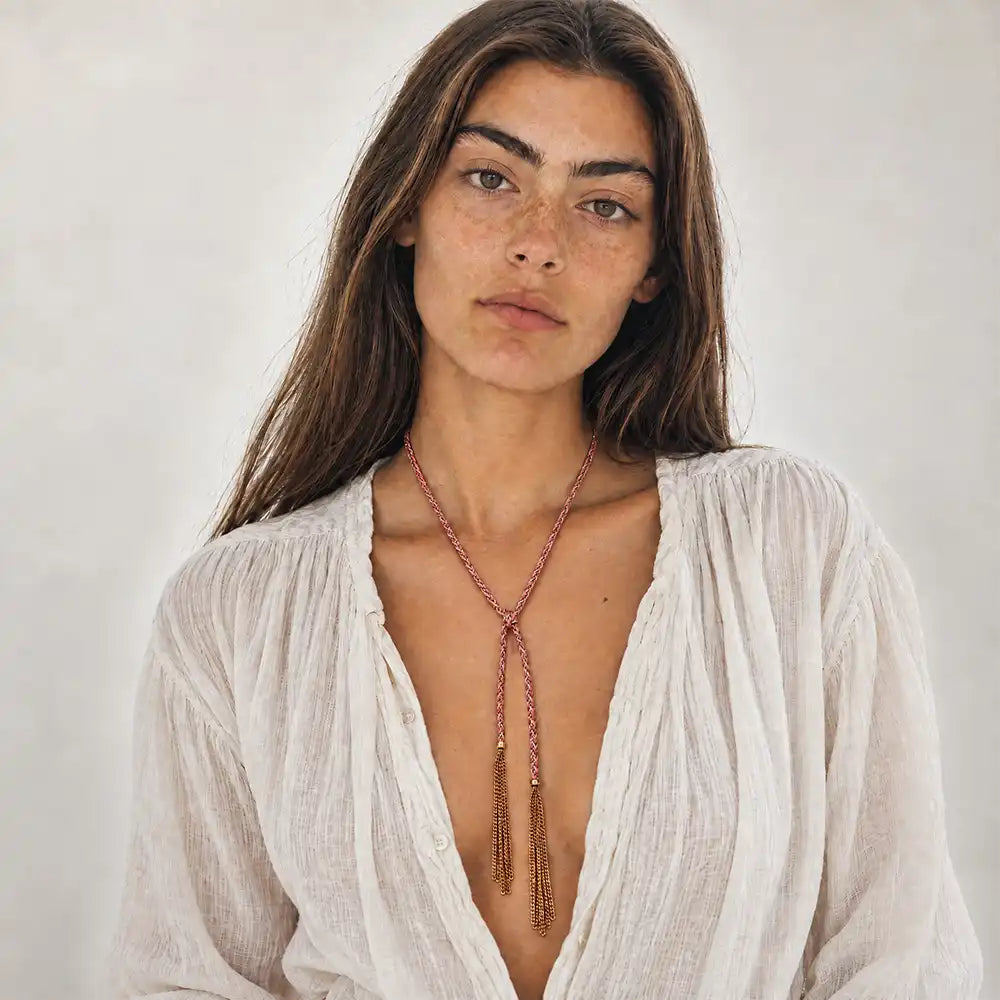 Pink braided chain and silk lariat necklace in 14K gold-fill, worn long on model