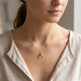 Handmade Pink Topaz Necklace shown on model. variant--Gold-fill, variant--Rose-gold-fill, variant--Sterling-silver, variant--Oxidized-sterling-silver variant--Pink-topaz