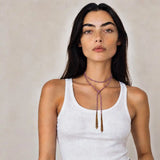 Purple braided chain and silk lariat necklace in 14K gold-fill, wrapped on model