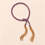 Purple braided chain and silk tassel bracelet in 14K gold-fill, flat lay