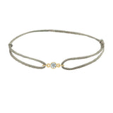 Silk knot adjustable bracelet with center round diamond in yellow gold