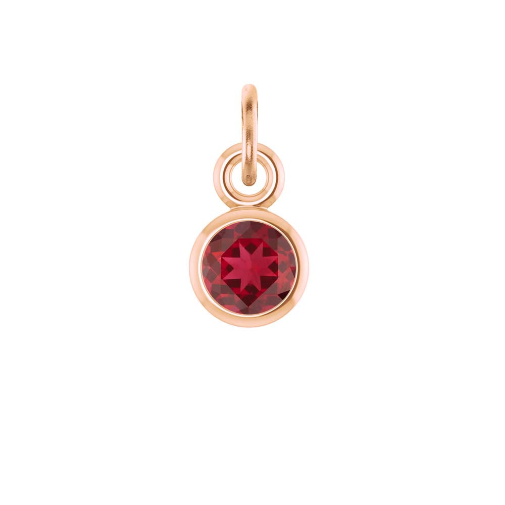 Ruby birthstone charm bezel-set in 14k rose gold — rich, romantic red gemstone for necklaces.