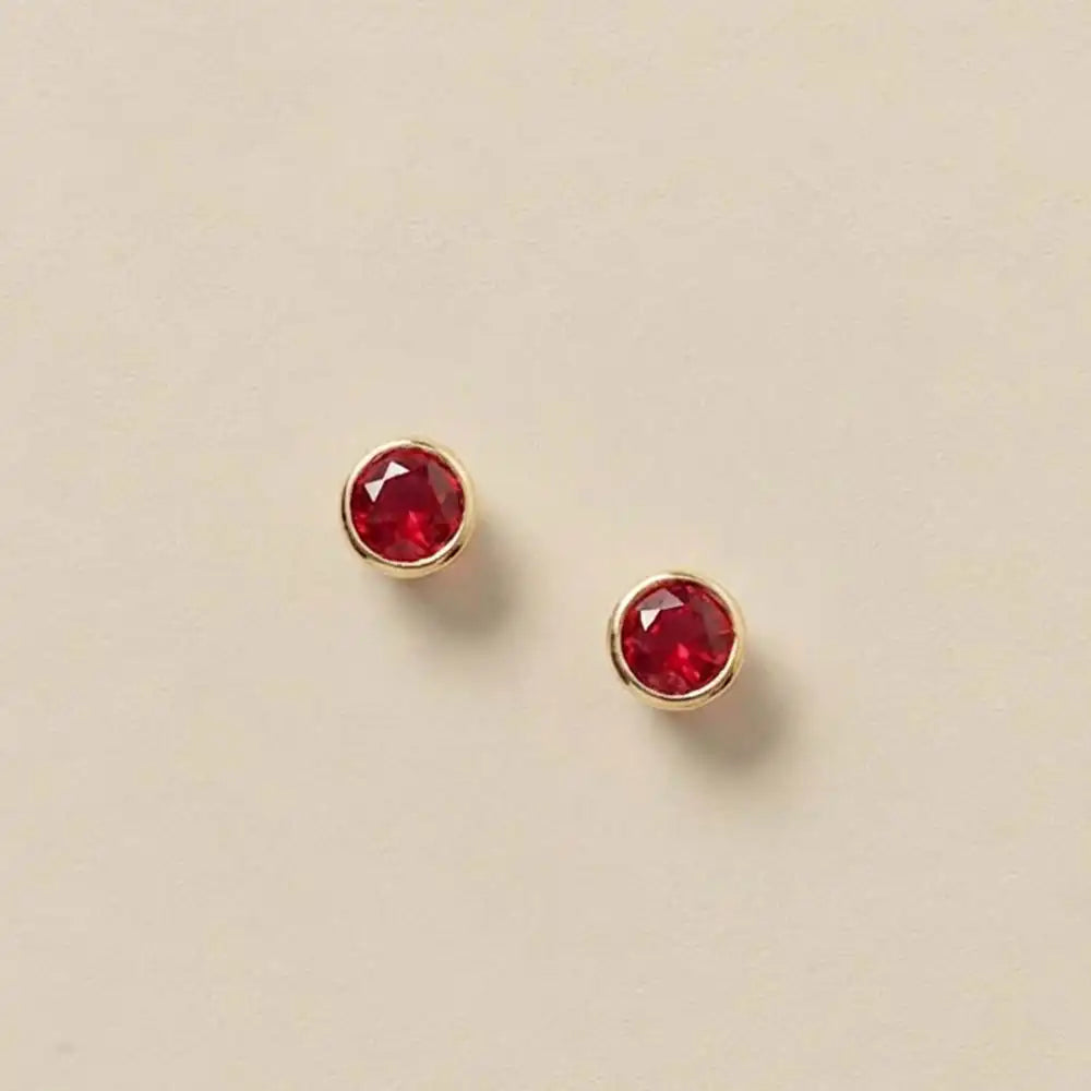 Ruby stud earrings in 14K gold, 4mm genuine ruby, product shot on white