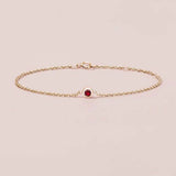 bezel set ruby bracelet in 14k gold