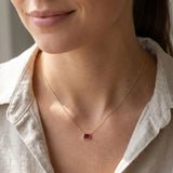 Minimalist birthstone necklace featuring Ruby shown on model variant--14K-yellow-gold variant--14K-white-gold variant--14K-rose-gold variant--Sterling-silver variant--Ruby