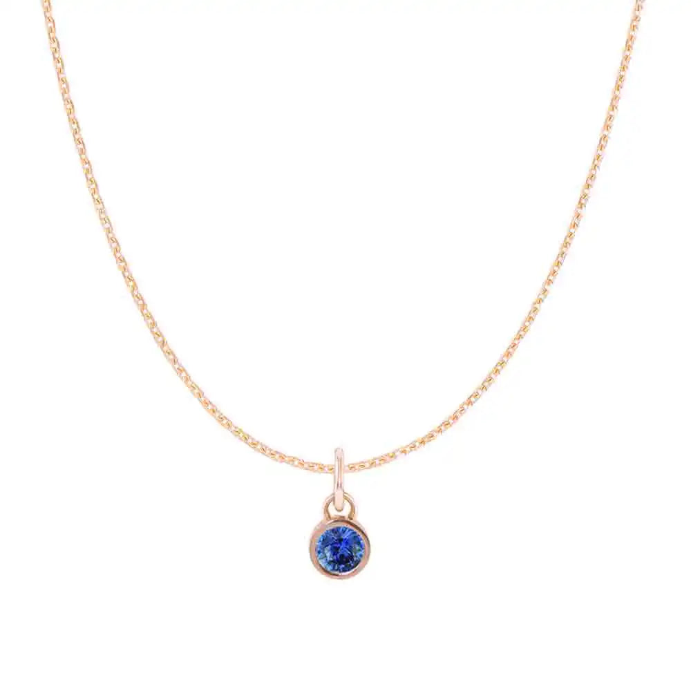 Natural sapphire birthstone charm necklace in 14K white gold, bezel-set pendant on cable chain, product shot variant--14K-white-gold variant--Sapphire
