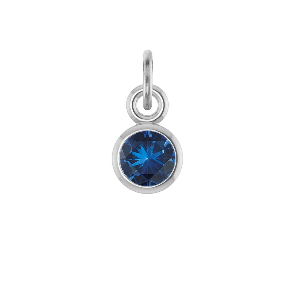 Sapphire birthstone charm bezel-set in 14k white gold — classic deep blue September gemstone.