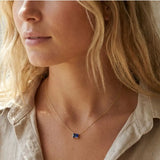 Minimalist sapphire necklace featuring a 5x3mm emerald shown on model variant-14K-yellow-gold variant-14K-white-gold variant-14K-rose-gold variant-Sterling-silver