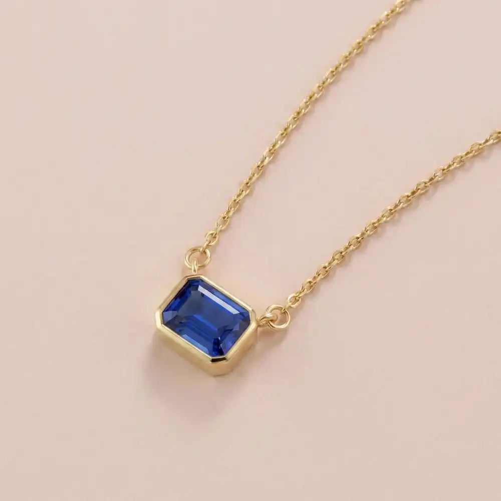 Emerald-cut sapphire solitaire necklace in yellow gold variant--14K-yellow-gold variant--14K-white-gold variant--14K-rose-gold variant--Sterling-silver variant--Sapphire