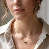 September birthstone necklace with deep blue sapphire shown on model variant--14K-yellow-gold variant--14K-white-gold variant--14K-rose-gold variant--Sterling-silver variant--Sapphire
