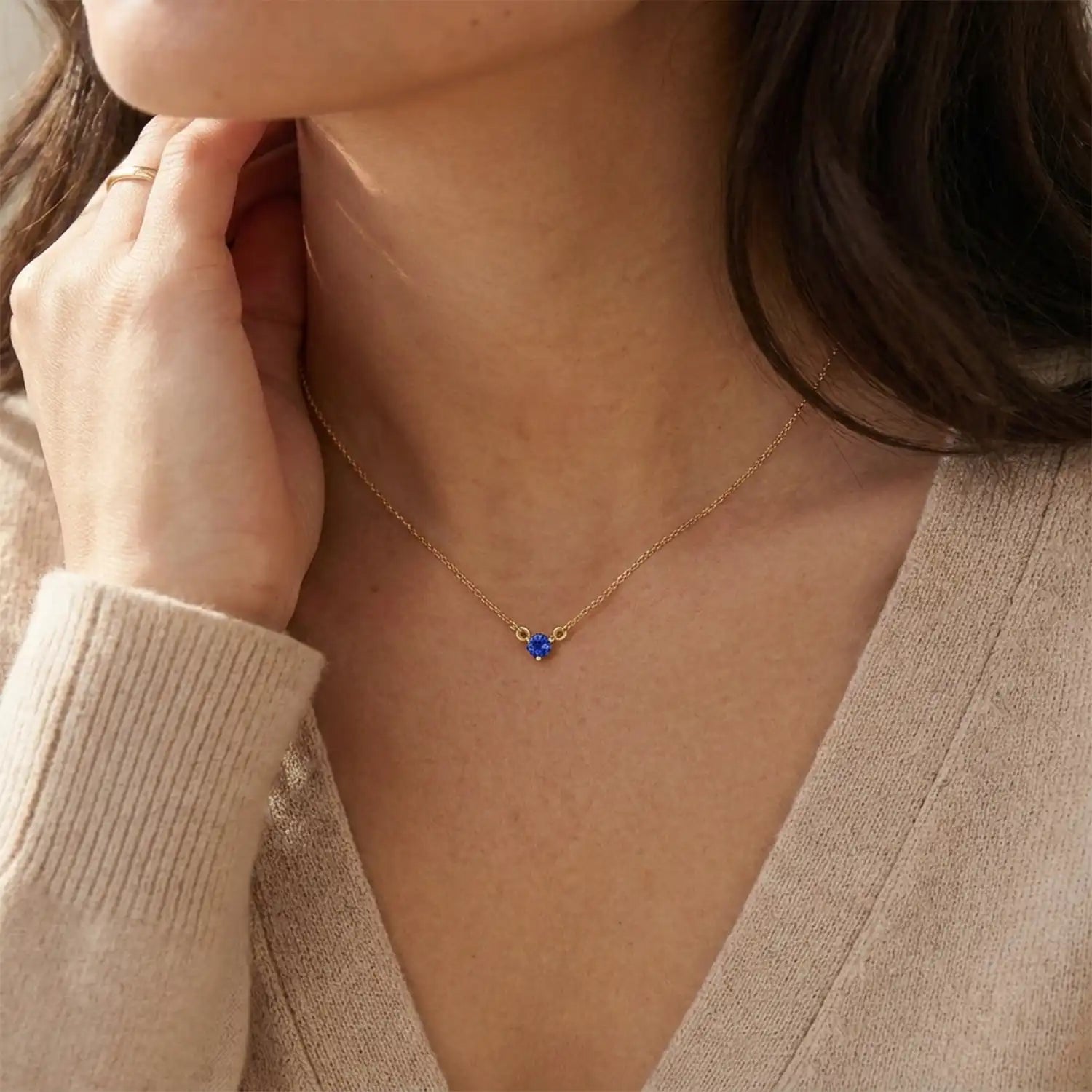 14K gold sapphire necklace shown on model variant--14K-rose-gold,  variant--14K-yellow-gold,  variant--14K-white-gold, variant--Sterling-silver, variant--Sapphire