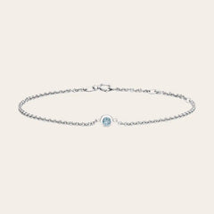 Bezel-set aquamarine bracelet flatlay showing blue stone and adjustable chain silver variant--Sterling-silver variant--Aquamarine