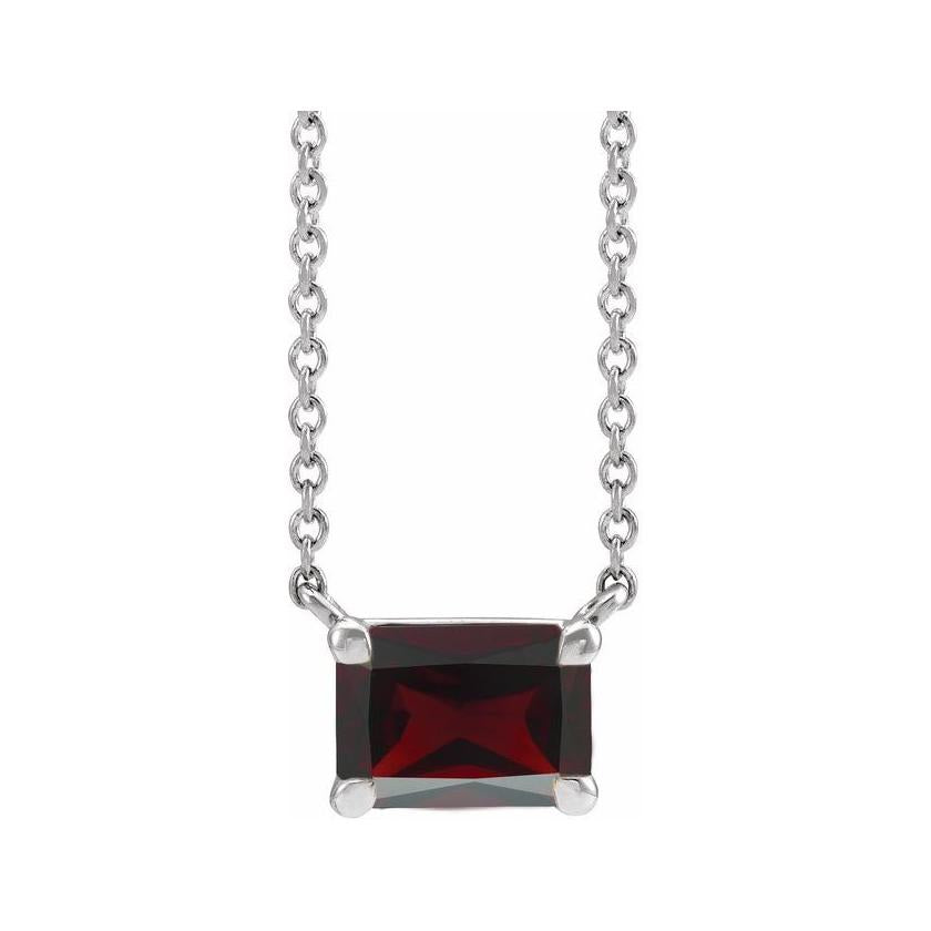 Modern sterling silver necklace featuring vertical emerald-cut garnet gemstone for birth month elegance