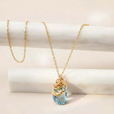 Natural swiss blue topaz pendant necklace in sterling silver, styled on chain necklace variant--Gold-fill variant--Sterling-silver variant--Swiss-Topaz
